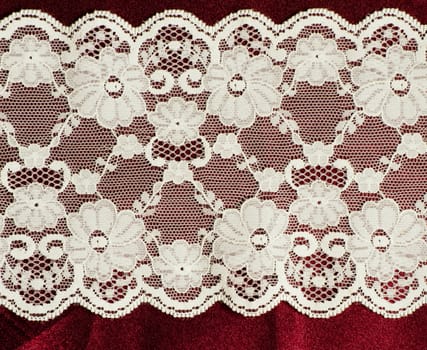 lace on the red satin fabric