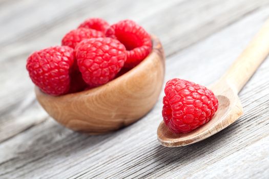 raspberries on wooden background