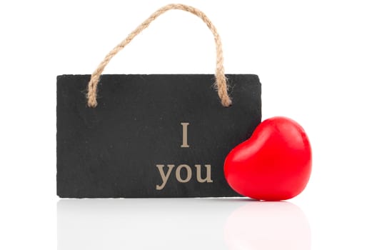 red heart with blackboard, on white wooden background
