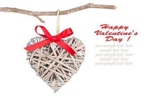 Heart shaped decoration made of wood, over white background