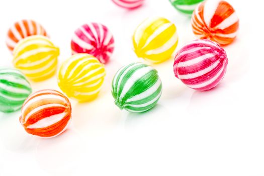 colored candies isolated on white.