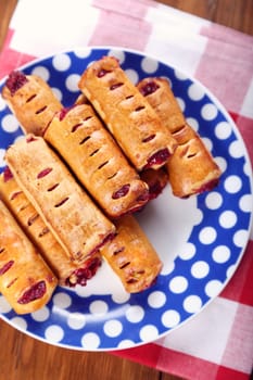 cakes with  strawberry jam on blue plate