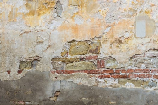 Deterioration of old wall, brick broken