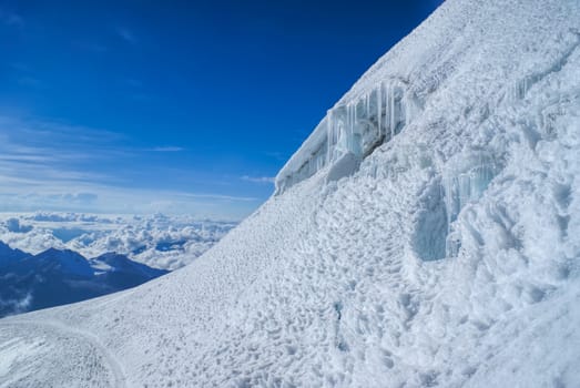 Trail in snow near top of Huayna Potosi mountain in Bolivia