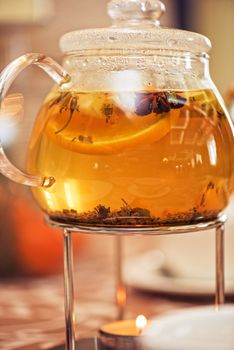 teapot of herbal tea on table 