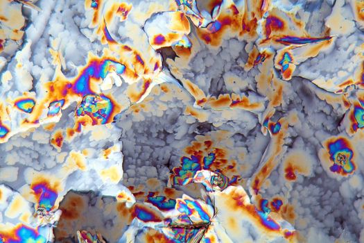 Potassium sulfate under the microscope (magnification 80x and polarized light). Potassium sulfate is a common reagent in fertilizers.