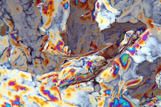 Potassium sulfate under the microscope (magnification 80x and polarized light). Potassium sulfate is a common reagent in fertilizers.