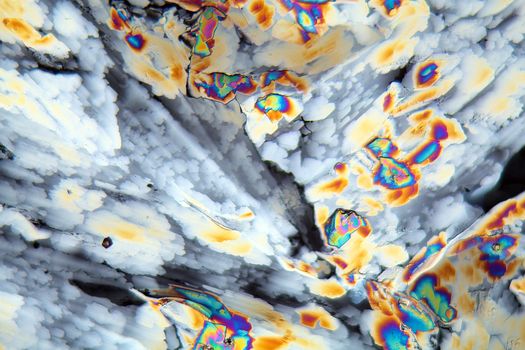 Potassium sulfate under the microscope (magnification 80x and polarized light). Potassium sulfate is a common reagent in fertilizers.