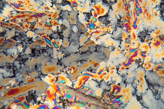 Potassium sulfate under the microscope (magnification 80x and polarized light). Potassium sulfate is a common reagent in fertilizers.