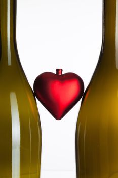 Empty bottles of wine and red heart