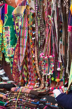 LA PAZ, BOLIVIA - NOVEMBER 10, 2014: Colorful bags, belts and textiles at a stand along the roadside in the city center on November 10, 2014 in La Paz, Bolivia