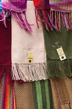 LA PAZ, BOLIVIA - NOVEMBER 10, 2014: Alpaca scarves hanging at a shop on Linares street in the city center on November 10, 2014 in La Paz, Bolivia