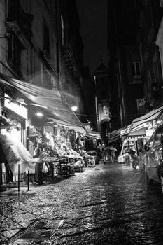 people walking in the alley of old town