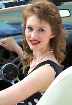 Female fashion model posing outside.