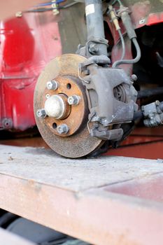 Closeup photo of car disc brakes servicing