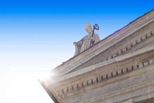 Monument of saint in the roof in the day