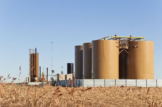 Storage tanks and treater for separating water from crude or condensate from natural gas in central Colorado, USA.