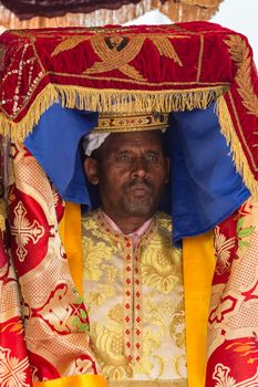 A priest carries the Tabot, a model of the Arc of Covenant, during a colorful procession of Timket celebrations of Epiphany, commemorating the baptism of Jesus, on January 19, 2015 in Addis Ababa.