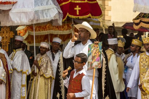 A man blows a traditional a traditional horn announcing the arrival of the tabot, representation of the arc of the covenant, during a colorful procession of the Timket (Epiphany) celebrations, on January 19, 2015 in Addis Ababa.