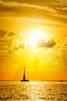 Sailboat and disherman in the sea at sunset, Key west bay, Floride, USA 