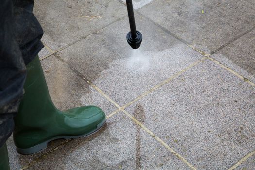 Outdoor floor cleaning with high pressure water jet