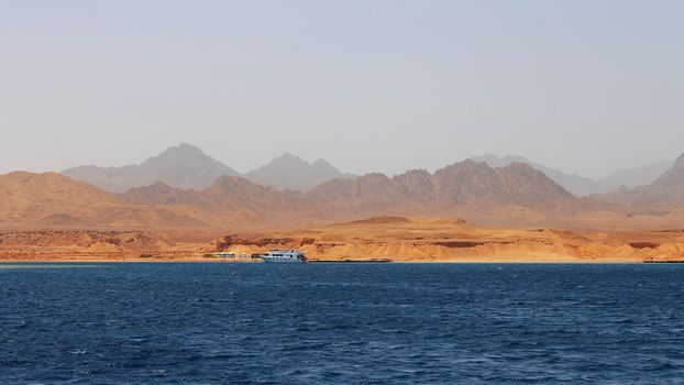 White Ship Moving By The Red Sea