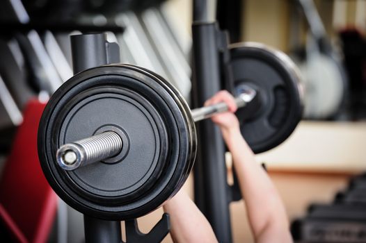 Barbell ready to workout, indooors, shallow DOF