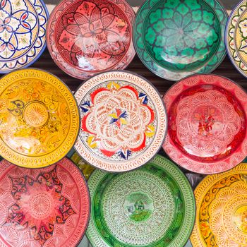 Traditional arabic handcrafted, colorful decorated plates shot at the market in Marrakesh, Morocco, Africa.