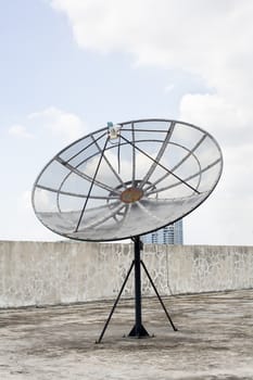 large old television Satellite on roof at blue sky background