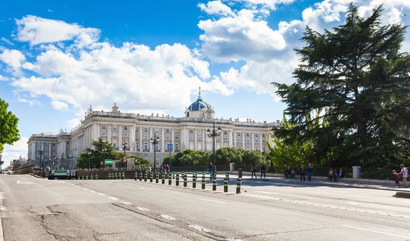 Madrid, Spain - May 6, 2012: Royal palace (Palacio Real de Madrid) with tourists on spring day in Madrid, Spain
