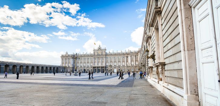 Madrid, Spain - May 6, 2012: Royal palace (Palacio Real de Madrid) with tourists on spring day in Madrid, Spain