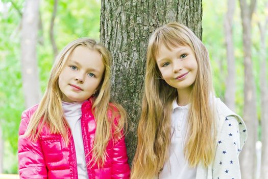 Photo of two cute girls with long hairs
