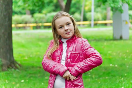Cute girl with blond long hair and blue eyes