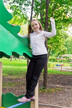Photo of cute playing girl in summer