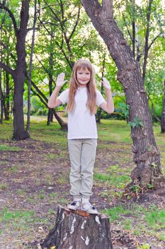 Photo of cute girl with upwards hands