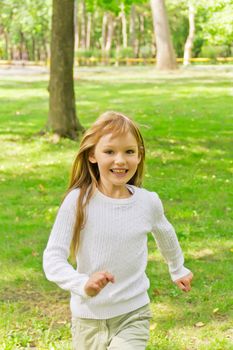 Photo of cute running girl in summer