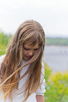 Photo of girl playing with long hair