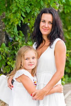 Photo of mother and daughter in white