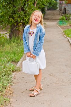 Cute beautiful girl makes faces imitate witch