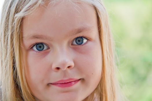 Photo of cute girl with big blue eyes