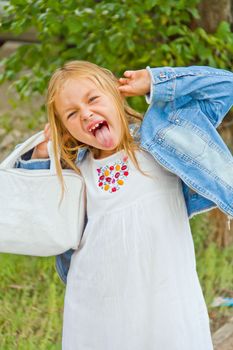 Cute beautiful girl makes faces imitate witch
