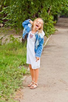 Portrait of cute girl with put out tongue