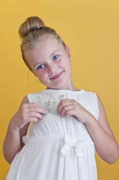 Cute girl with blond long hair and blue eyes