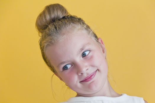 Cute girl with blond long hair and blue eyes