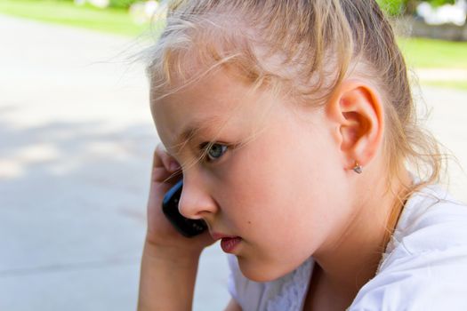 Photo of cute girl talking by cellular