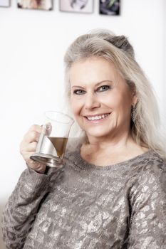 An image of a best age woman with a cup of tea
