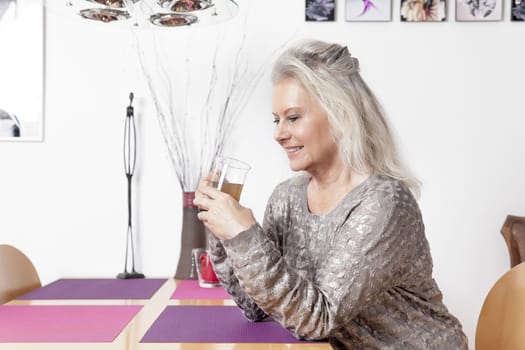 An image of a best age woman with a cup of tea