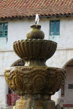 The Historic Mission Santa Barbara in California USA with fountain in the foreground.