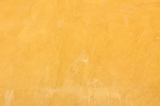 Neon vibrant yellow orange grungy wall texture