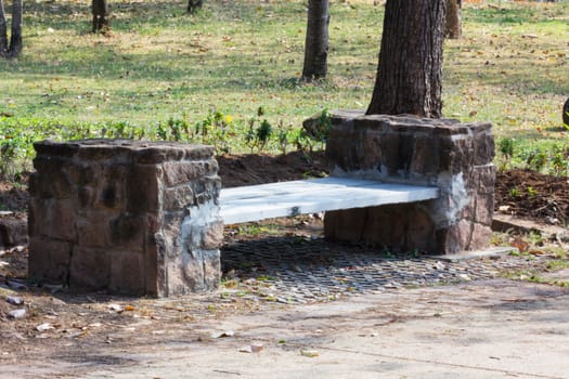 very old granite chair in garden in Thailand